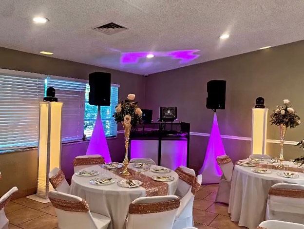 wedding dj set up in florida for a mexican wedding including dance floor lights, speakers, and dj booth